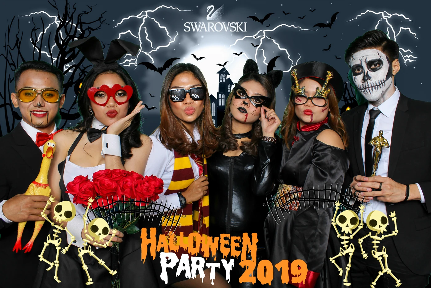 A photo booth group using a green screen background